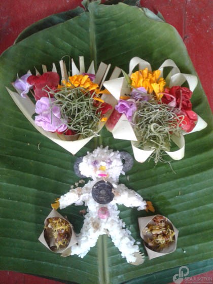 A white rice figure was placed in the household temple for Shiva, god of reincarnation. (Photo by Garrett Kam)